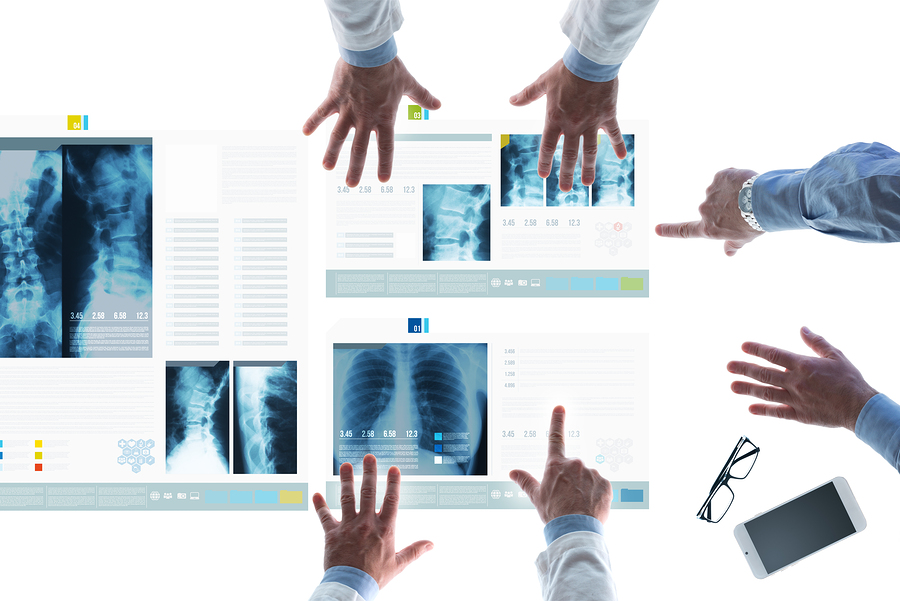 Doctors examining X-Rays, HIPAA