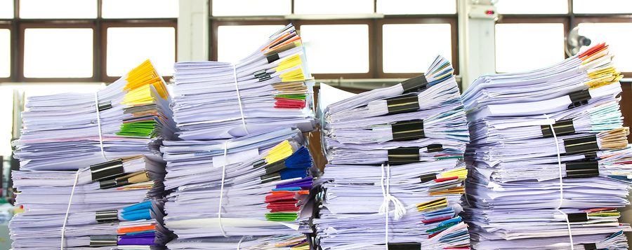 Stacks of documents that require document storage