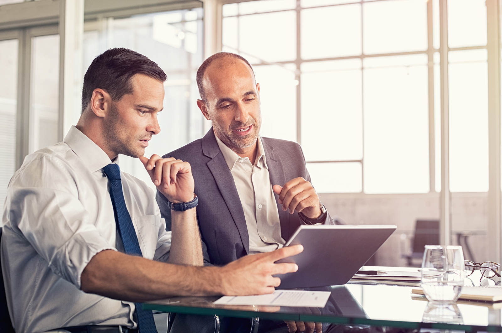 Businessman using a digital tablet to discuss information