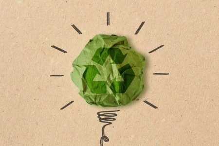 Light bulb drawing with recycling sign on crumpled recycled paper - Concept of ecology and recycling