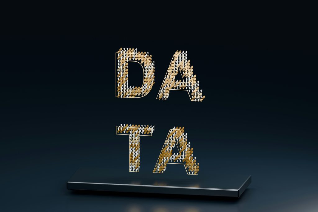 Small white and yellow items formed to spell out the word data in capital letters floating in space above a metallic platform
